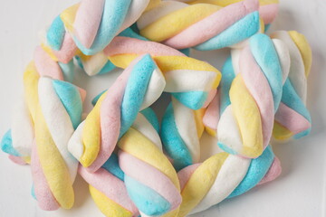 Marshmallow twists. Colored sweet chewy candies
