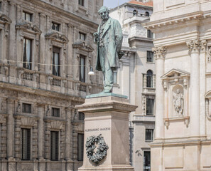 Obraz premium San Fedele Square, Milan, bronze monument in memory of Alessandro Manzoni, famous poet and writer