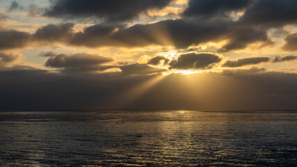 view on the wadden sea of the north sea at low tide at sunset near bernersiel