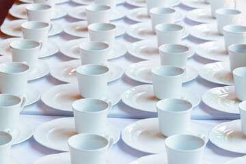 White ceramic mugs. Group of empty coffee cups. White cup for service tea or coffee in breakfast or buffet and seminar event.