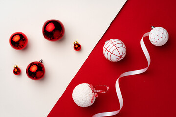 Christmas baubles on red and white paper background