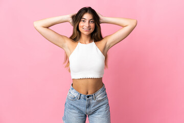 Young caucasian woman isolated on pink background laughing