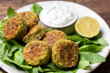 Vegetarian spinach falafel, healthy green food. Closeup view