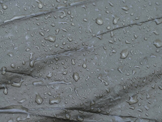 texture large raindrops on the fabric of the tent