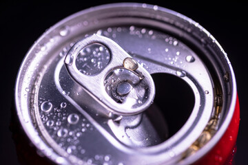 Open aluminum can with water drops or dew close-up macro shot, top view