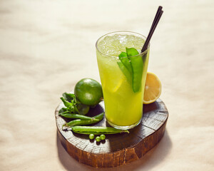 pea lemonade on a wooden stand in a glass glass