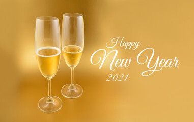 Happy New Year 2021 shiny golden background with glass of champagne stock images. Two festive glasses of champagne photo images. Happy New Year 2021 golden greeting card. New Year toast images