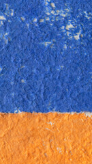 Fototapeta premium Close-up of blue and orange paper, texture background