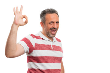Naklejka premium White man smiling showing okay gesture with copyspace