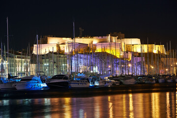 The historic 'Fort St Nicholas' illuminated at night in Marseille harbour