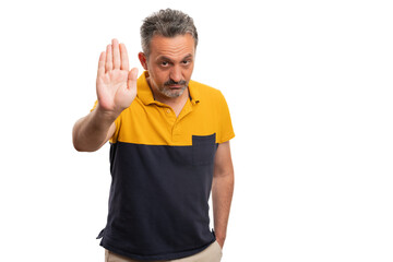 Naklejka premium Adult with serious expression making stop gesture using palm