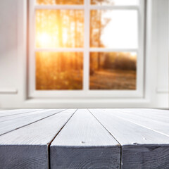 Desk of free space and blurred autumn window background 
