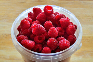 Ripe red raspberry berries close up. Natural vitamin food