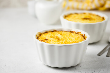 Rice millet porridge in baking dishes. Space for text.
