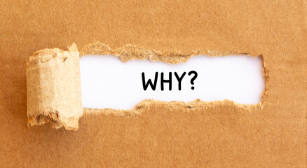 Text Why appearing behind torn brown paper