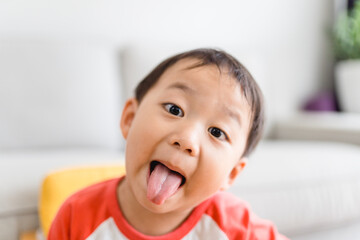 Naughty or stubborn boy.Asian toddler boy child happy in Halloween .Asian home school kid stay at home in Halloween holiday.Self centered or headstrong.Emotion, Pre school kid, Ef EQ,Kid Funny face.