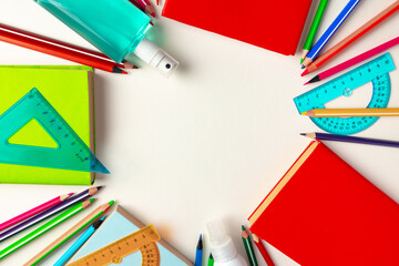 Top view of school supplies, pencils and notepad