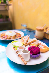 Belgian waffles with fruit and chocolate, forest fruit, all homemade, delicious batter