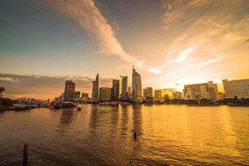 Fototapeta premium Bitexco Financial Tower building, buildings, roads, Thu Thiem 2 bridge and Saigon river in Ho Chi Minh city - This city is a popular tourist destination of Vietnam.
