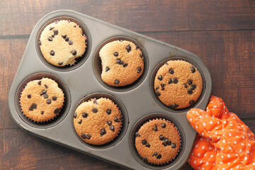 Top view of women hand holding chocolate pan cake.