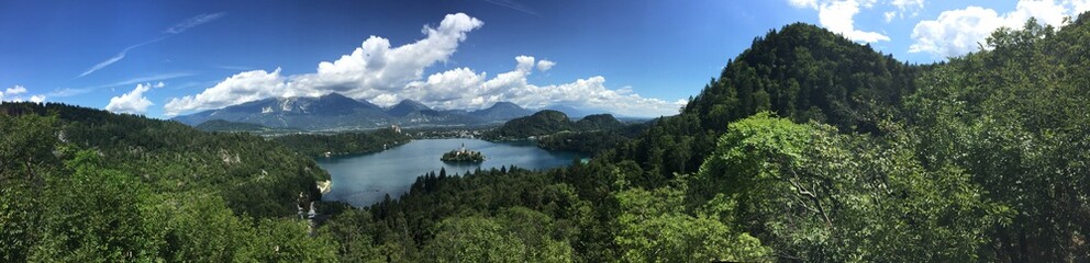 Fototapeta na wymiar Panorama of Lake Bled with St Mary's church on the small island, Bled, Slovenia, Europe