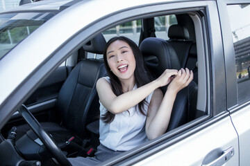 Fototapeta na wymiar woman hand fastening a seat belt in the car