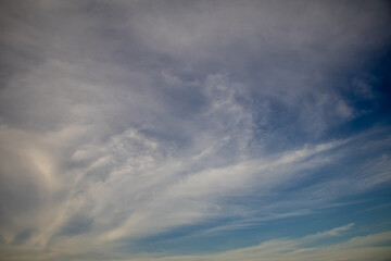 Deep blue sky and white cloud background.