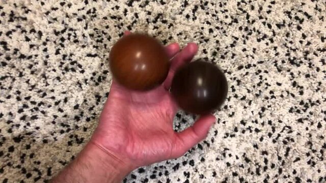 skilled hands juggling wooden balls