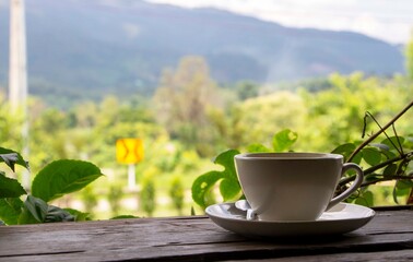 a cup of coffee on wooden table
