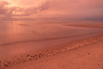 Beautiful waves on the beach with in sunrise.