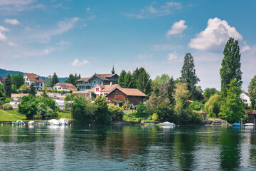 Fototapeta na wymiar Cityscape Scenery and Swiss Village Culture at Stein Am Rhein City, Switzerland. Beautiful Nature Waterfront View of Rhine River With Swiss Architecture House Building at Summer. Travel Destination