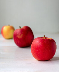 red apples on wooden table