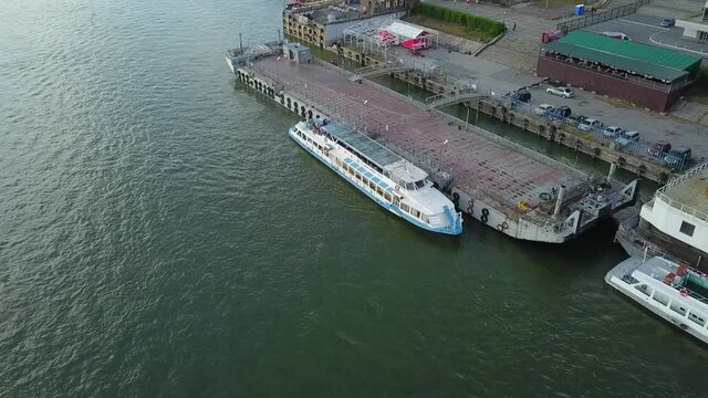 a flying camera chases a passenger boat on the ob river in siberia