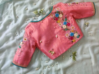 Beautiful pink designer blouse with flower thread work embroidery for woman on sari