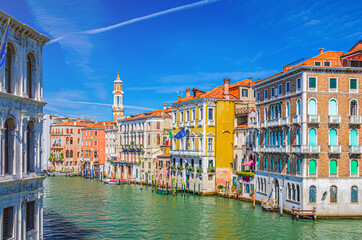 Grand Canal waterway in Venice historical city centre with Palazzo Civran palace, Venetian colorful buildings and Church of the Holy Apostles of Christ bell tower. Veneto Region, Northern Italy.