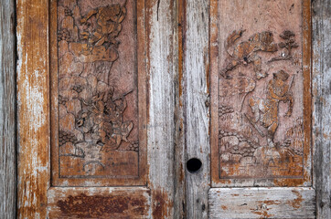 Thai art pattern, old carvings on old wooden doors