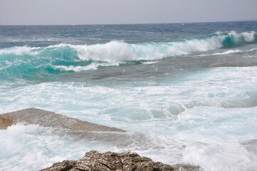 Big waves breaking on shore - wave splashing on rock. waves on the beach.
