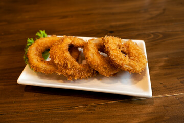 Onions fried on a wooden table