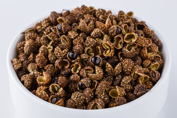 fragrant Sichuan pepper on white acrylic background