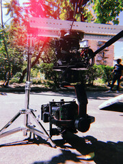 movie camera on the slider in the backlight from the window, the rays of the sun in a smoky room