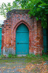 wooden door in an old brick wall