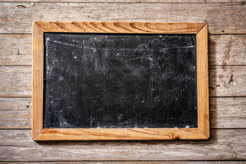 Empty blackboard on wooden background