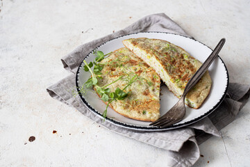 French omelet with zucchini and spices.