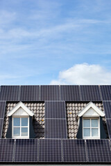 Alternative energy from solar panels on a roof with two dormers