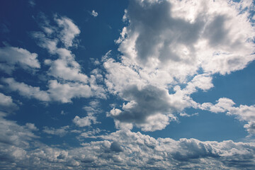 cumulus clouds set against a blue sky.