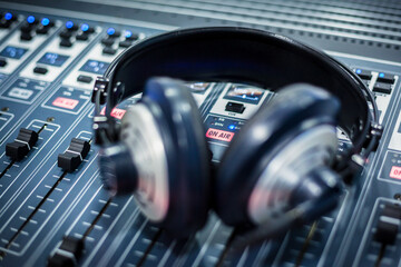 Fototapeta na wymiar Close-up of radio headphones on sound mixer