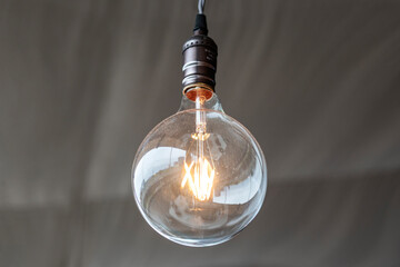 edison bulb hanging from the ceiling on a wire