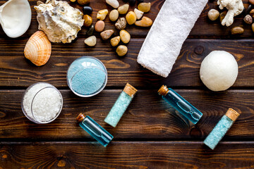 Obraz na płótnie Canvas Spa set bar of sea cosmetics - aroma oil and blue salt. Above view