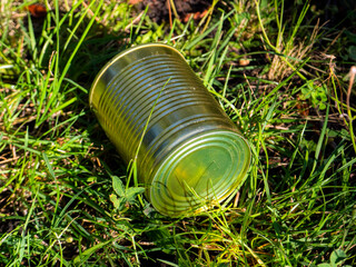 Tin can isolated on green grass