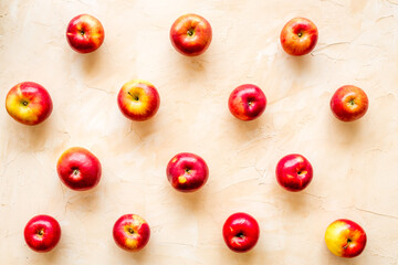 Fruit pattern of red apples on table desk top view